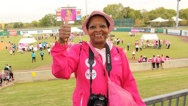 Dena Childrey, co-chair of Saturday's annual Making Strides Against Breast Cancer event, gives a big thumbs up to signify another success. Alvin Benn/Special to the Advertiser.