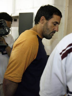 Darren Mack, 45, is brought into the Dallas County Jail by law enforcement officials, Friday, June 23, 2006, in Dallas.
