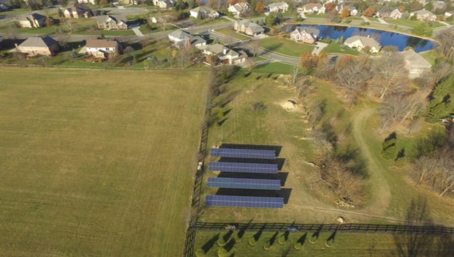 Several Carmel residents believe the city should not have approved a large solar array in a residential area. David Luedtke is building the solar array to power his house.