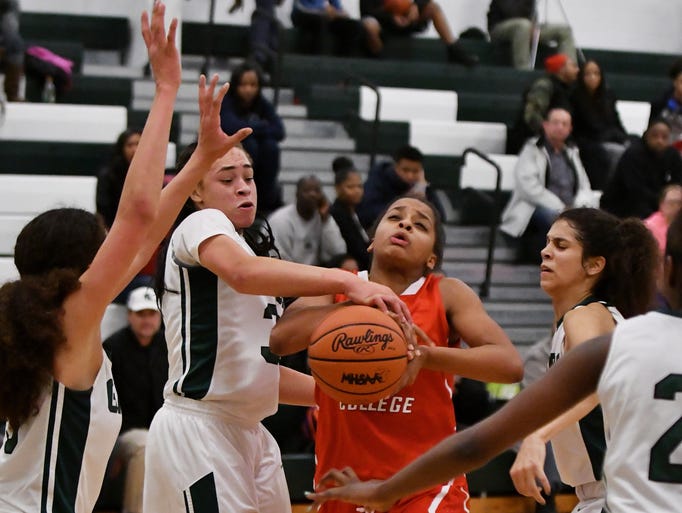Arbor Prep's Mahri Petree, left, tries to strip the