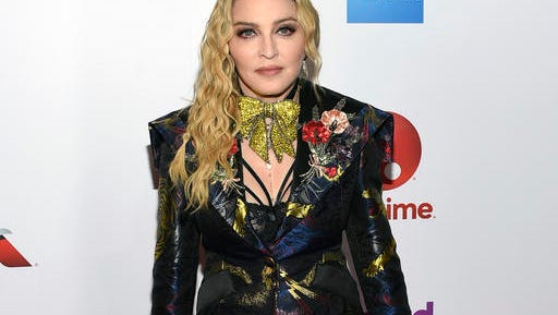 Madonna attends the 11th annual Billboard Women in Music honors at Pier 36 on Friday, Dec. 9, 2016, in New York. Billboard Women in Music 2016 will air Dec. 12 on Lifetime. (Photo by Evan Agostini/Invision/AP)