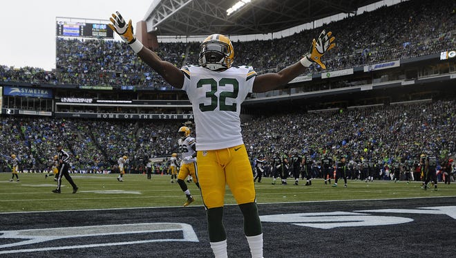 Green Bay Packers' Chris Banjo (32) reacts toward the crowd after making a tackle against the Seattle Seahawks during Sunday's NFC Championship game at CenturyLink Field in Seattle, Wash.