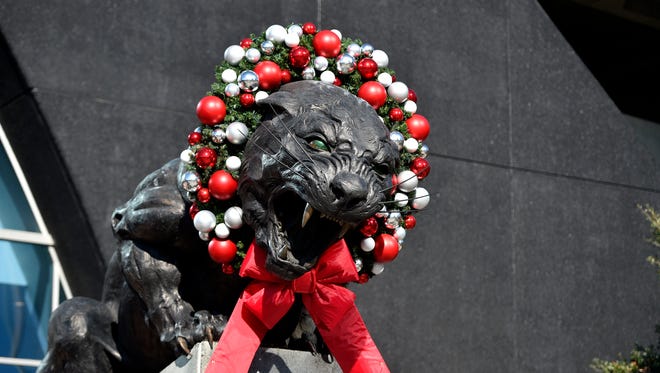 The Panthers statue is decorated for Christmas at Bank of America Stadium.