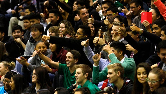 Farmington High School students react during a school assembly Jan. 12 at Scorpion Gym in Farmington. Students throughout the district will see a number of early-release days switched to delayed-start days during the upcoming school year.