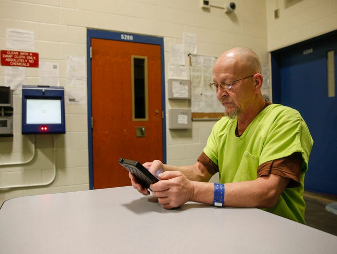 Photos Polk County jail inmates receive tablets