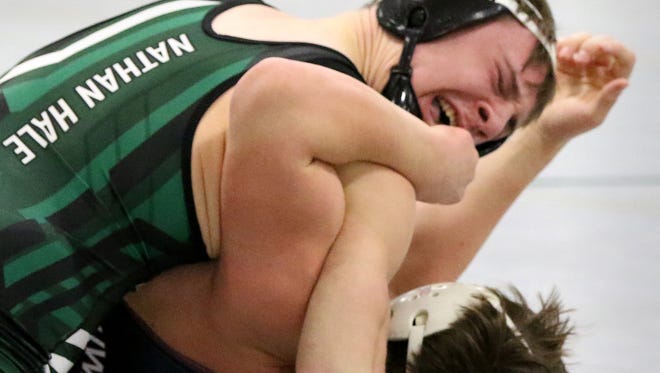 West Allis Hale's Peyton Mocco pins Wauwatosa's Simon Doyle in a 170-pound match at Wauwatosa West on Jan. 25.
