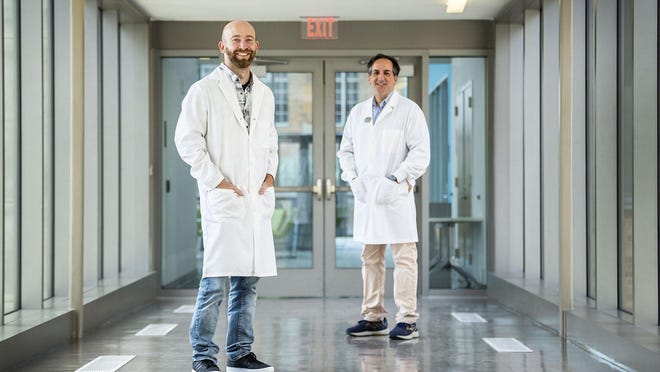 Jason Lavinder, left and Gregory Ippolto, two scientists at the University of Texas, have developed an antibody test for the coronavirus that they say is more accurate, less expensive and can be scaled more easily than those currently in use.