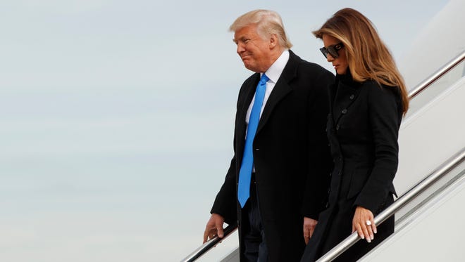 President Donald Trump and his wife Melania arrive at Andrews Air Force Base, Md., Thursday, Jan. 19, 2017, ahead of Friday's inauguration.