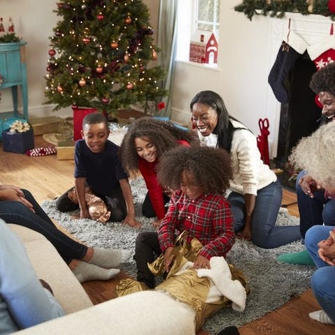 A family opening gifts on Christmas morning.