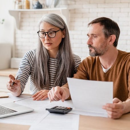 Mature couple working on tax preparation