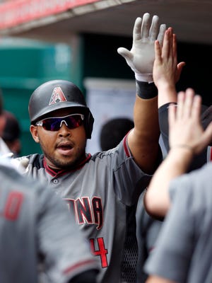 Jul 24, 2016: Arizona Diamondbacks left fielder Yasmany Tomas celebrates in the dugout after hitting a solo home run against the Cincinnati Reds during the second inning at Great American Ball Park.