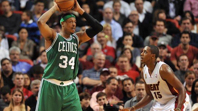 October 30, 2012;  Miami, Florida, USA;  Boston Celtics junior forward Paul Pierce (34) is pressured by Miami Heat point guard Mario Chalmers (15) during the second half at American Airlines Arena.  Mandatory credit: Steve Mitchell-USA TODAY Sports