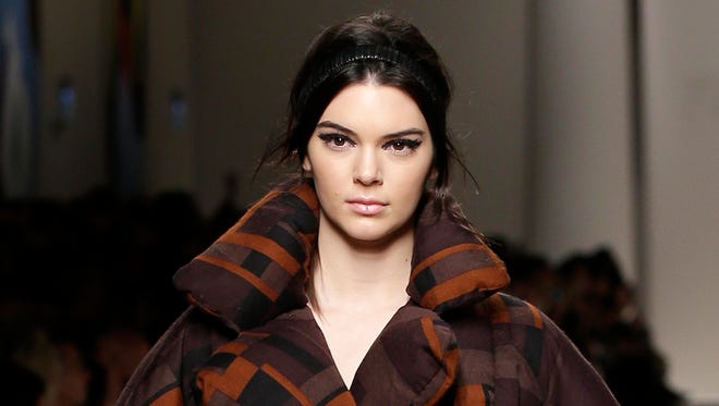 Model Kendall Jenner wears a creation for Fendi women's Fall-Winter 2015-2016 collection, part of Milan Fashion Week, unveiled in Milan, Italy, Thursday, Feb. 26, 2015.