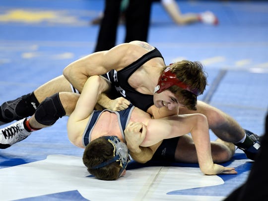 Emerson/Park Ridge's Luke Mazzeo, top, wrestles Lacey's Luke Moynihan in a 132-pound bout during the preliminary round of the NJSIAA wrestling championships. Mazzeo won by pin.