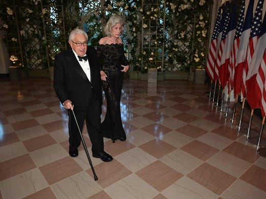 Henry Kissinger and his wife, Nancy, arrive at the