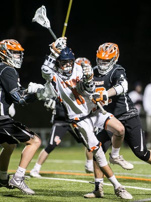 York Suburban's Lucian St. Onge (8), gets sandwiched by Central York's Alex Kilgour (18) and Chris Brandstedter (19), during the third quarter of a boys' lacrosse match Thursday, March 30, 2017, at York Suburban High School in Spring Garden Township. Central York won 9-7. Amanda J. Cain photo 