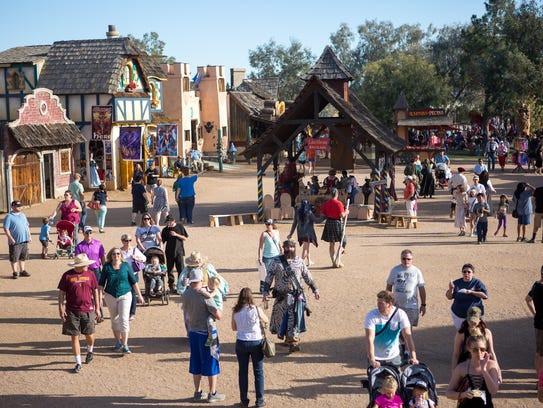 People walk through the Arizona Renaissance Festival