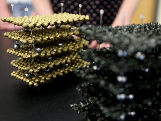 Atomic-level models of iron pyrite quantum dots, left,