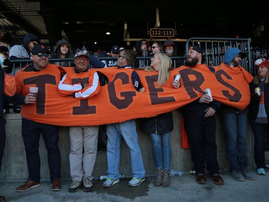 Tigers fans wear an extended shirt they sewed in 2006, during Opening Day last year against the Red Sox.