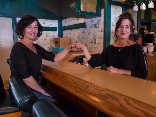 Shelly and Sheila LaCroix sit at the bar in the former