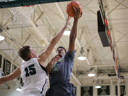The University of Vermont's Trae Bell-Haynes (2) makes