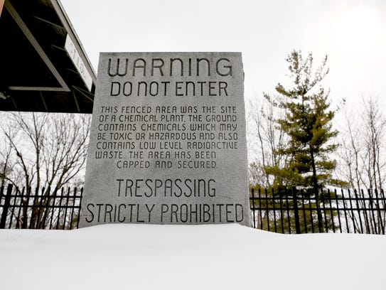A granite gravestone that once warned people of hazardous