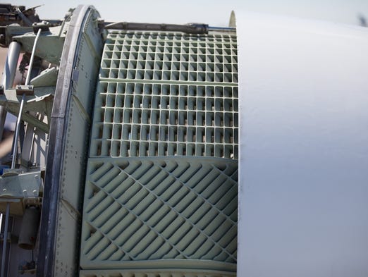 An open thrust reverser awaits a new home. Until then,