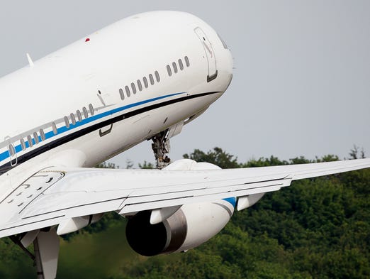 A private Boeing 757-200 departs Seattle's Boeing Field
