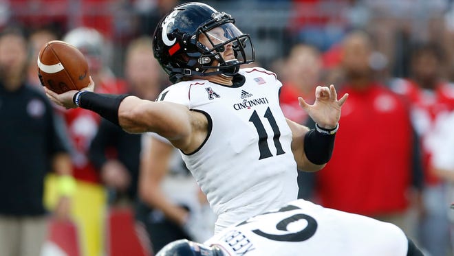 UC's Gunner Kiel launches a touchdown pass to Chris Moore against Ohio State on Sept. 27.