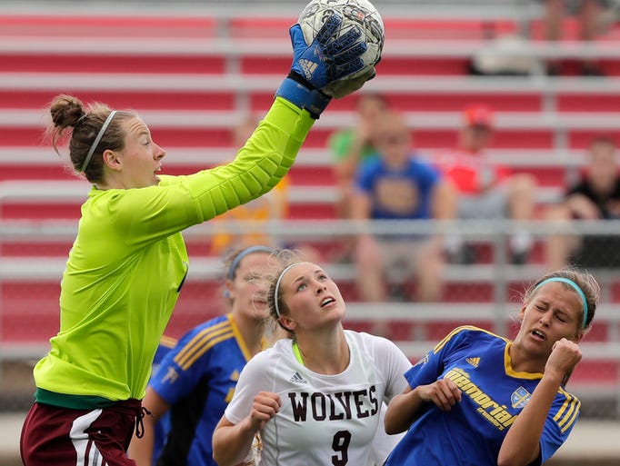 Winneconne goalie Sadie Kosciuk (1) claims the ball