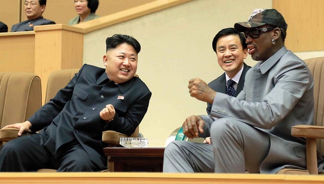 This photo taken on January 08, 2014 and released by North Korea's official Korean Central News Agency (KCNA) on January 9, 2014 shows North Korean leader Kim Jong-Un (C), his wife Ri Sol-Ju (L) and former US basketball star Dennis Rodman (R) watching a basketball game between former NBA players and North Korean players at Pyongyang Gymnasium in Pyongyang.      THIS PICTURE WAS MADE AVAILABLE BY A THIRD PARTY. AFP CAN NOT INDEPENDENTLY VERIFY THE AUTHENTICITY, LOCATION, DATE, AND CONTENT  OF THIS IMAGE. THIS PHOTO IS DISTRIBUTED EXACTLY AS RECEIVED BY AFP.  AFP PHOTO / KCNA via KNS   REPUBLIC OF KOREA OUT   RESTRICTED TO EDITORIAL USE - MANDATORY CREDIT  " AFP PHOTO /KCNA/AFP/Getty Images ORIG FILE ID: 525851041