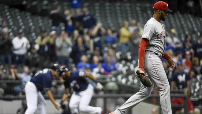 Amir Garrett gave up two home runs to Brewers first baseman Eric Thames in the team's 11-7 loss to Milwaukee on Monday.