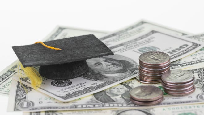 A graduation cap and a pile of money.