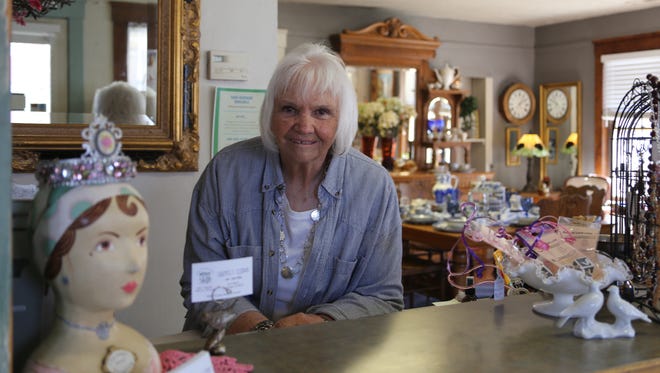 Lyn Averett works the counter at Carmell's Cottage Antiques and Home Treasures in St. George on March 6, 2018.