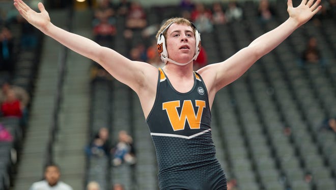 Cody Eaton of Windsor High School celebrates a third-place win over Tony Ulaszek of Greeley Central during the CHSAA State Wrestling Championships at the Pepsi Center in Denver on Saturday.