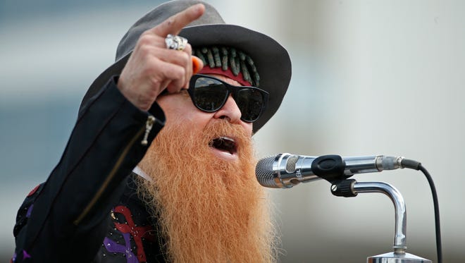ZZ Top guitarist Billy Gibbons performs before the start of the NASCAR Sprint Cup series auto race at Charlotte Motor Speedway on May 24 in Concord, N.C.