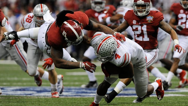 Reuben Foster (10) and the Alabama Crimson Tide have been picked by three representatives on the Big Ten Network's website to beat Wisconsin on Saturday at AT&T Stadium in Arlington.