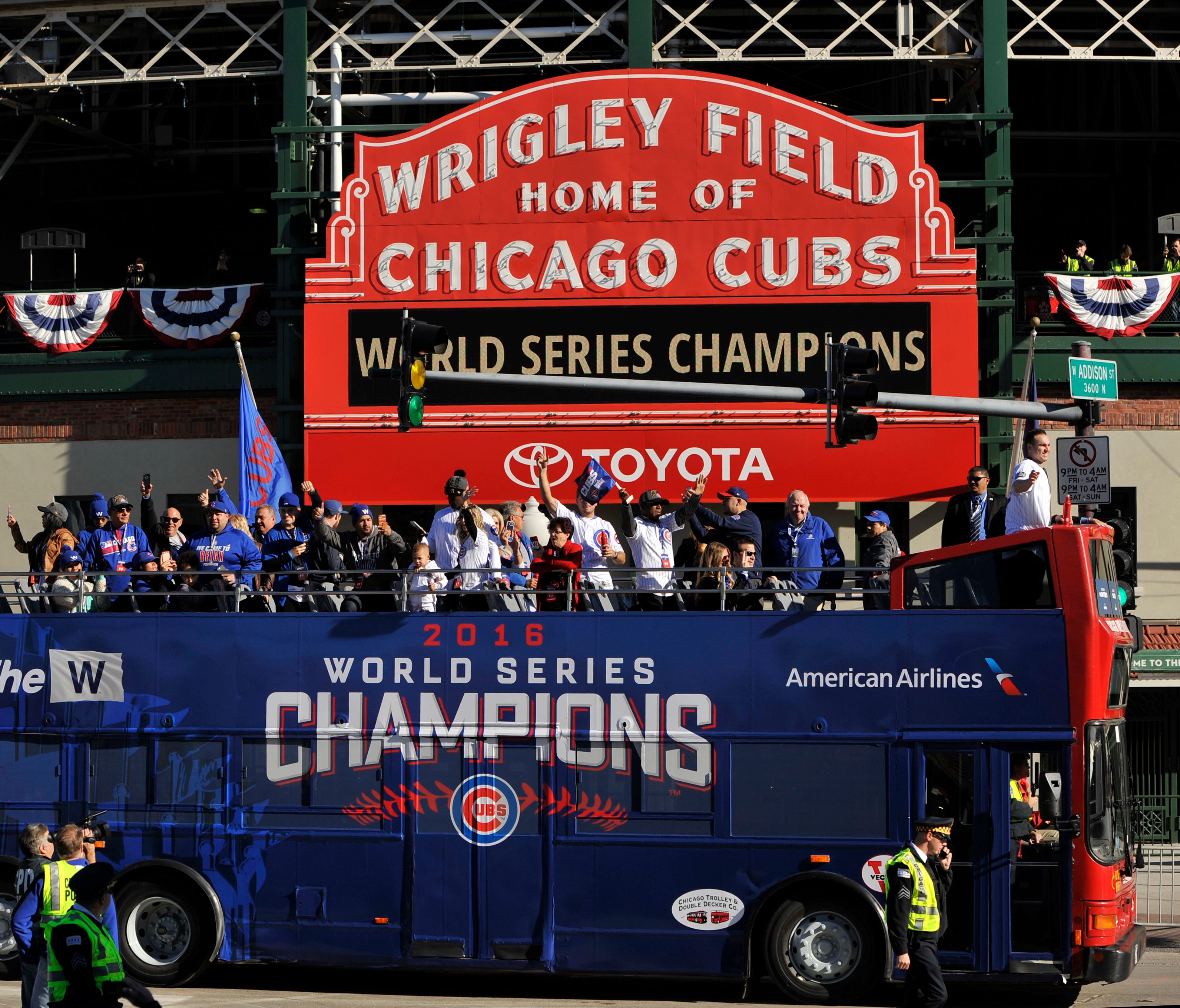 Wrigley Field already looked different with this message during the team's championship parade. Monday night, it will get a World Series banner.