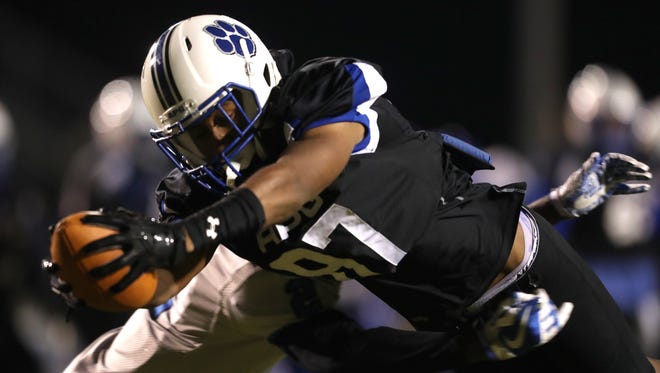 Godby's Nicholas Dixon dives in for a touchdown on a reception against Trinity Christian Academy during their Region 1-5A Semifinal game at Cox Stadium on Friday, Nov. 17, 2017.