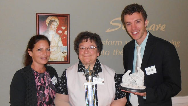 Felician Village recently announced that activity aide Bernadette Zandonatti, middle, won the Service Excellence Star Award for the month of July.