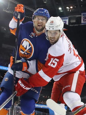 Josh Bailey of the New York Islanders and Riley Sheahan, right, of the Detroit Red Wings battle Dec. 4, 2016, in New York.
