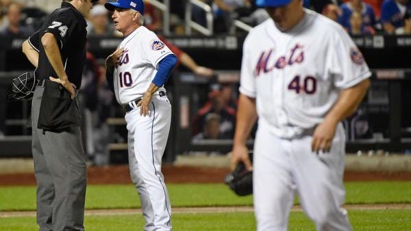 Mets manager Terry Collins argues with umpire John Tumpane, left, as starting pitcher Bartolo Colon, right, leaves the game after being ejected Thursday night.