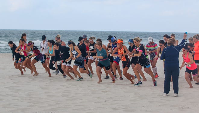 Racers compete in the 22nd annual Mullet Man Triathlon sponsored by the Flora-Bama Lounge, Package & Oyster Bar last year. The year's triathlon gets going at 7:30 a.m. Saturday, April 13.