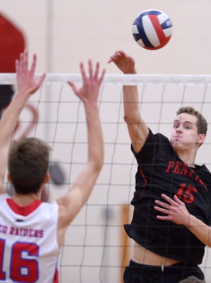 Penfield's Jack Bittker, right, hits past the block of Fairport's Mitch D'Agostino during a match at Fairport High School on Oct. 24, 2016. Penfield beat Fairport 3-0 (25-22, 25-16, 25-11).