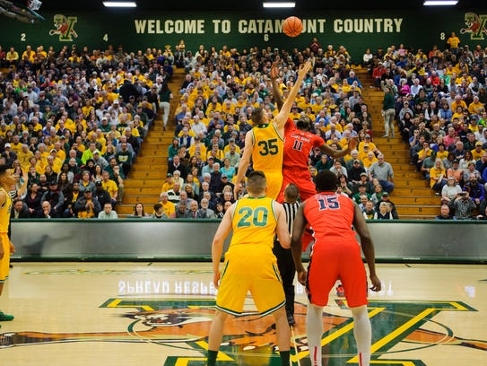 Vermont's Payton Henson (35) and Stony Brook's Junior