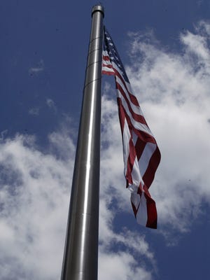 Acuity's record-breaking flagpole was dedicated Monday June 16, 2014, during a patriotic ceremony that included Gov. Scott Walker, Milwaukee singer Danny Gokey, area veterans and dignitaries and thousands of local residents. 