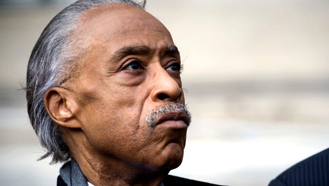 The Rev. Al Sharpton, founder of National Action Network, looks up while speaking with the news media outside of the Justice Department following his meeting, along with other civil rights leaders, with Attorney General Jeff Sessions on March 7, 2017.