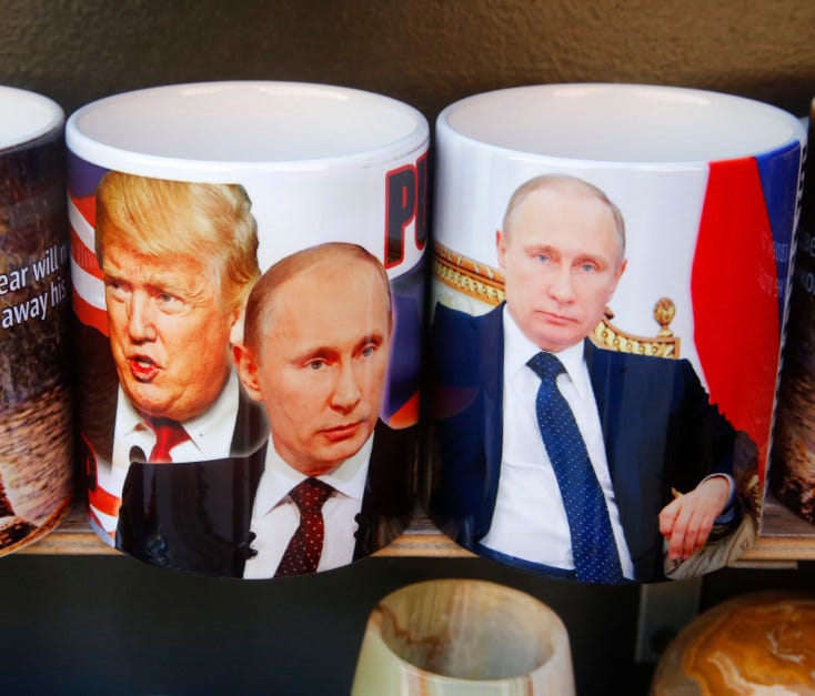 Cups depicting Russian President Vladimir Putin and President Trump are displayed in St. Petersburg, Russia, on Jan. 20.