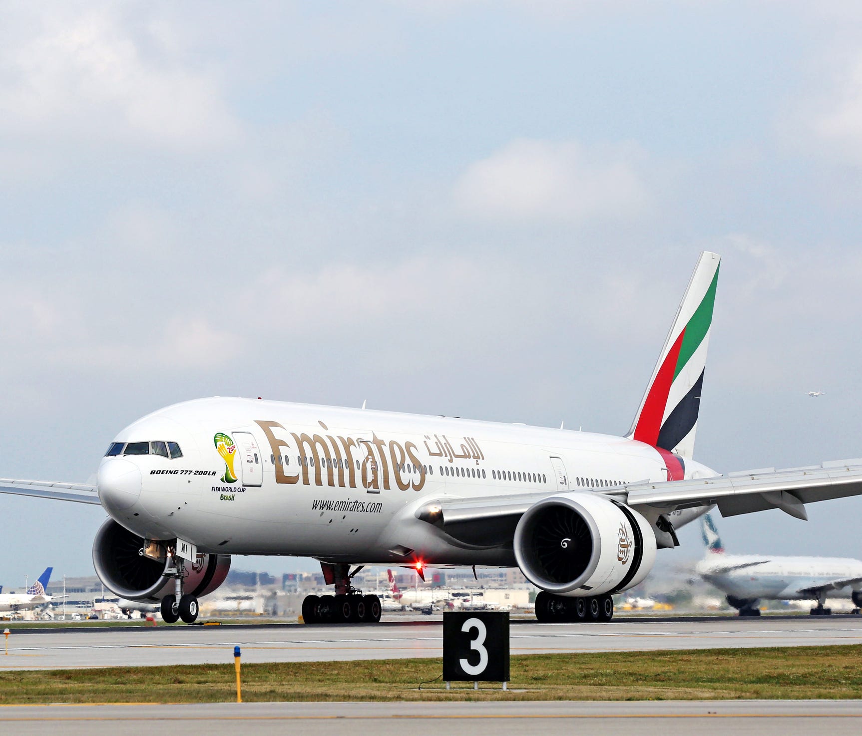 In this file photo from August 2014, an Emirates airline Boeing 777-200LR touches down at O'Hare International Airport for the carrier's inaugural flight into Chicago.
