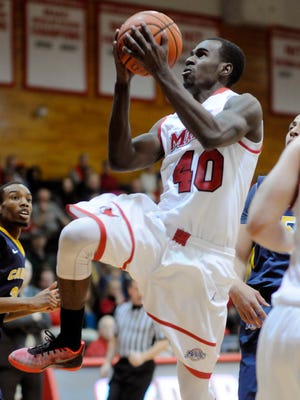 Marist College senior Chavaughn Lewis goes to the hoop against Canisius College on Thursday in the Town of Poughkeepsie.